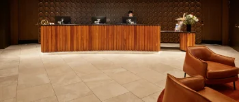 Hotel reception in warm wood and low light